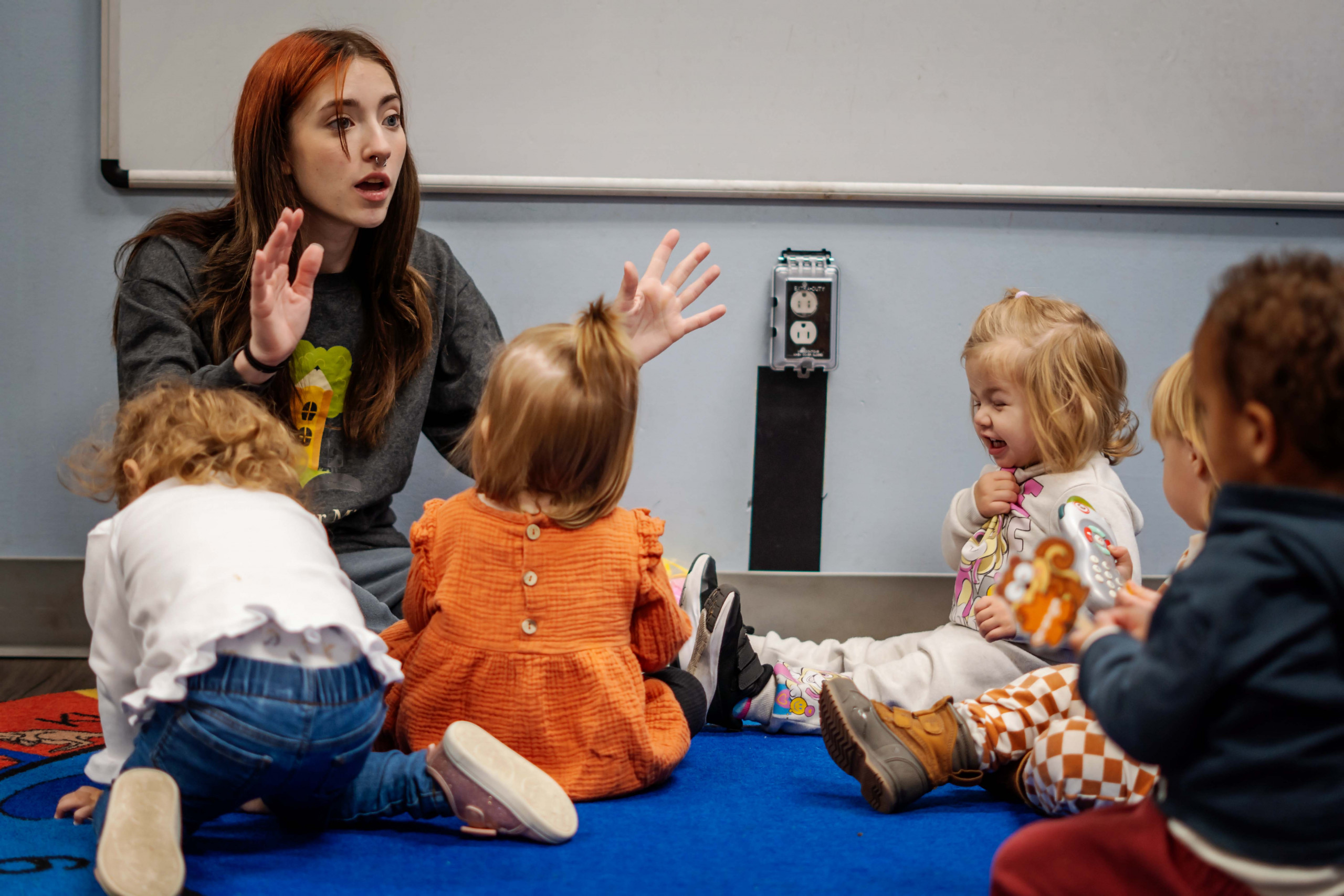 Children exploring an activity table together